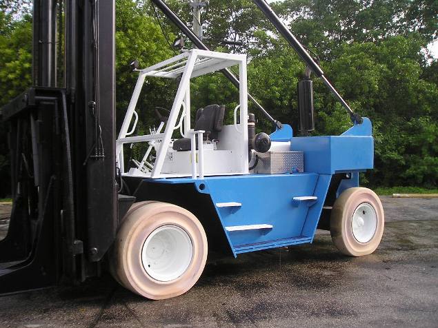 Wiggins Marina Bull Model W220 Marine forklift for sale 22000 capacity 30' used to hoist boats and Travel lift into Wiggins dry storage racks at boat yards and marinas.