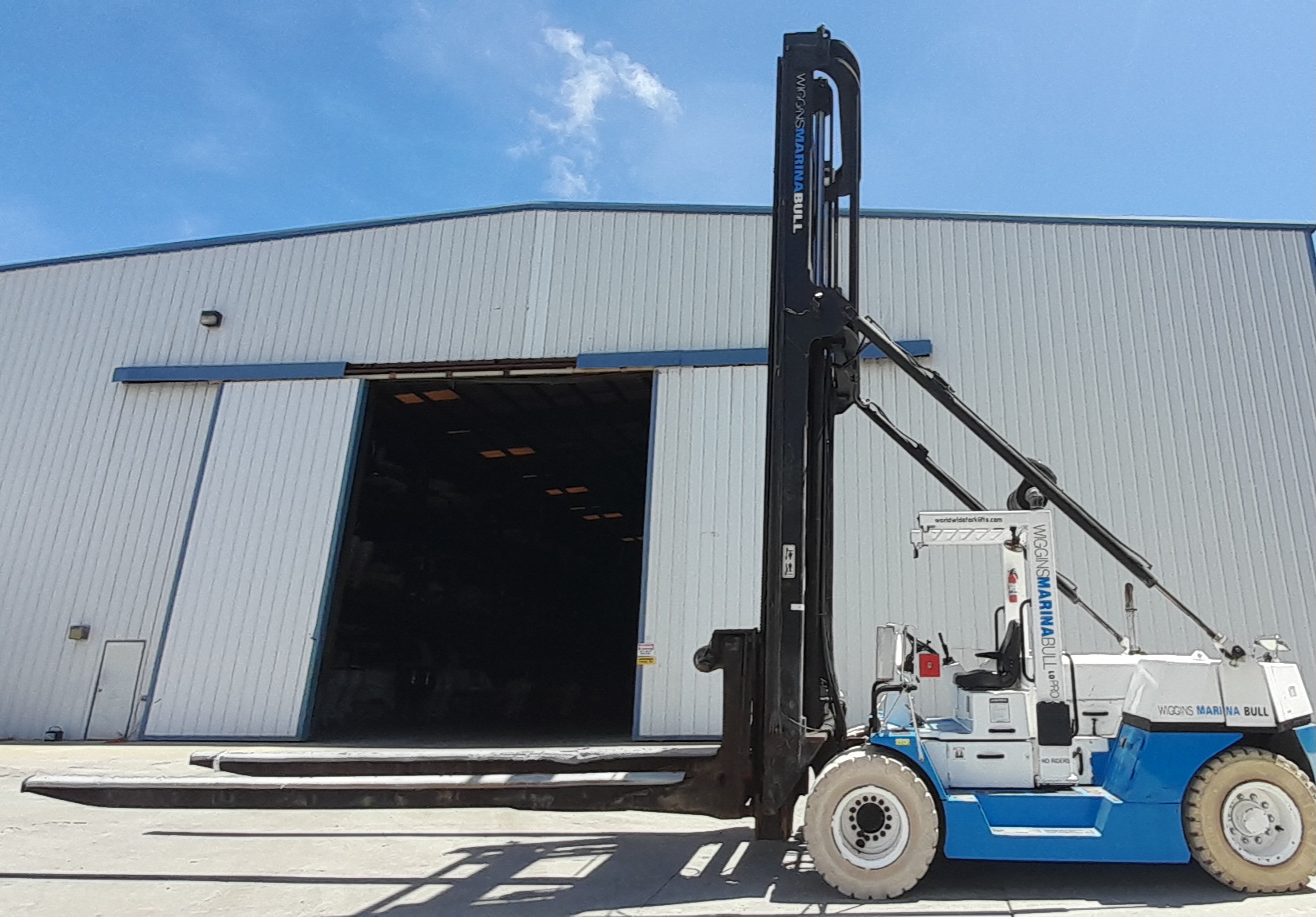 Taylor TMH125 Marine forklift for sale 25000 capacity 30' used to hoist boats and Travel lift into Wiggins dry storage racks at boat yards and marinas.